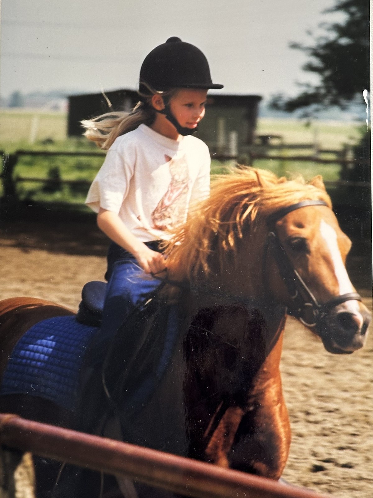 A young Zilla van den Born riding a Shetland pony