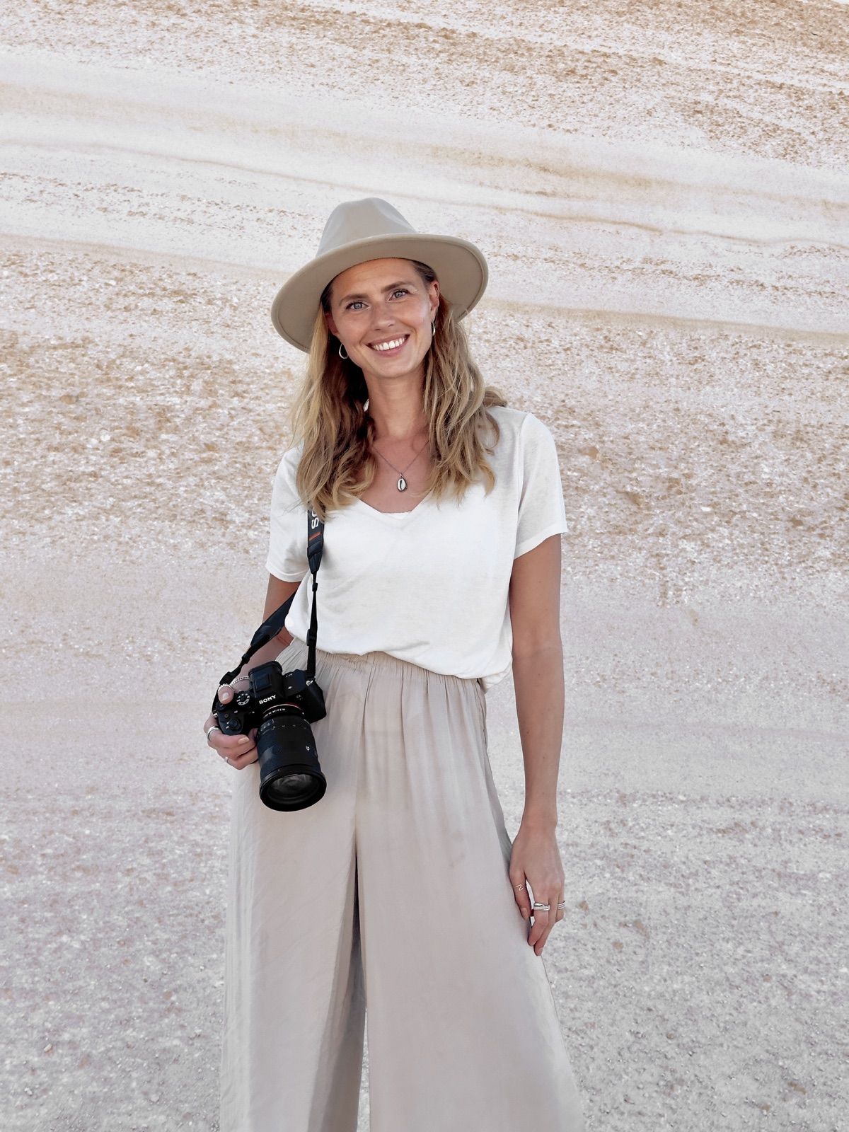 Zilla van den Born with a camera around her neck