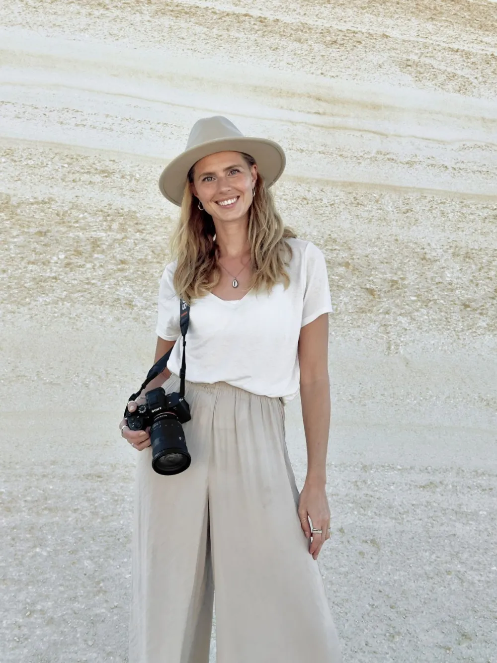 Zilla van den Born with a camera around her neck